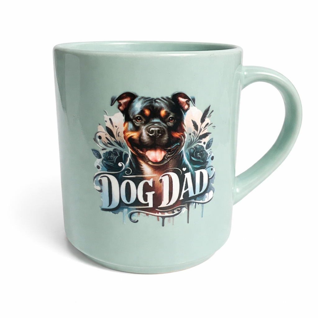 Mint green mug with a dog illustration and 'Dog Dad' text on a white background