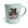 Mint green mug with a dog illustration and 'Dog Dad' text on a white background