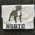 White t-shirt with black graphic and 'NSBTC' text on a textured surface