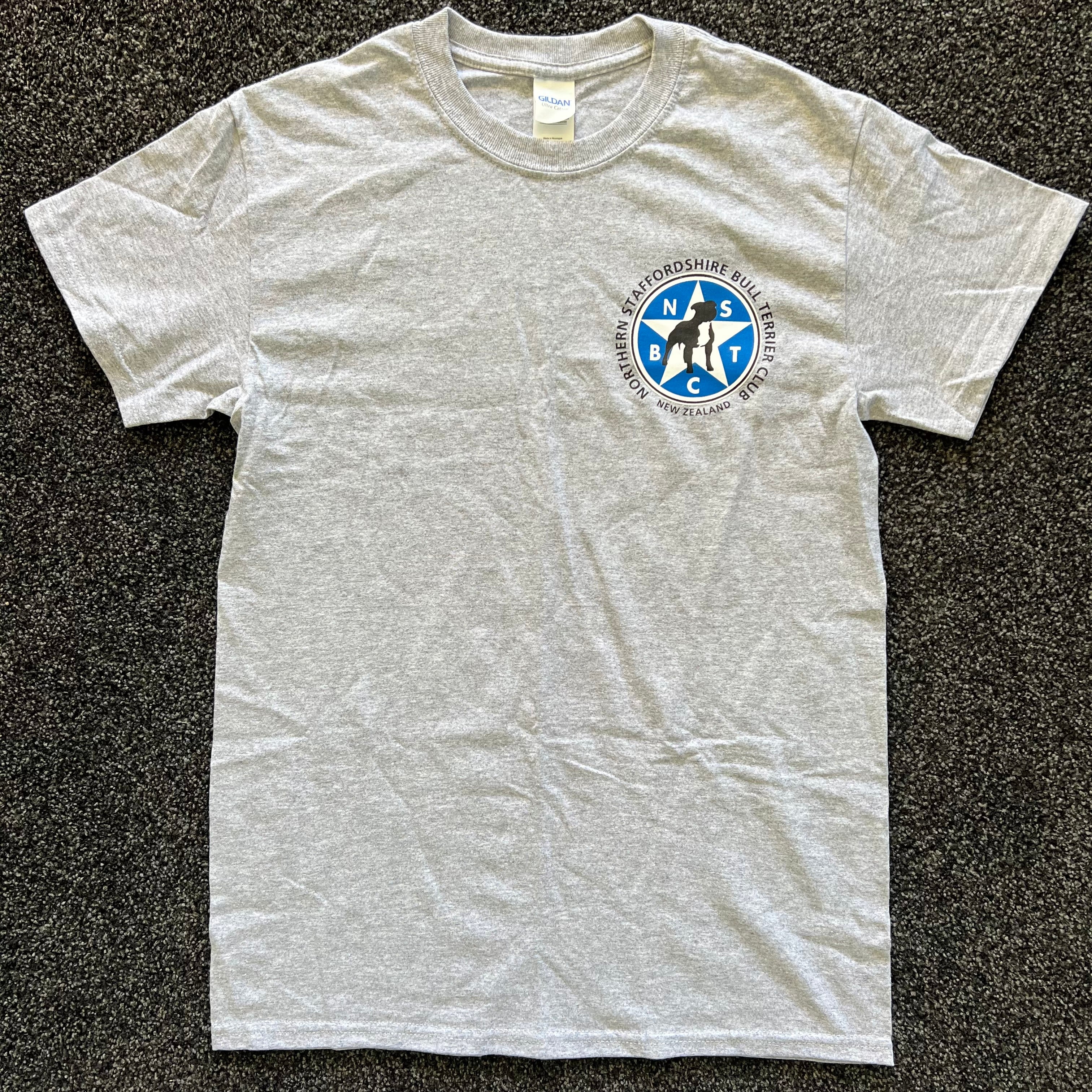 Gray t-shirt with a logo on a black textured background