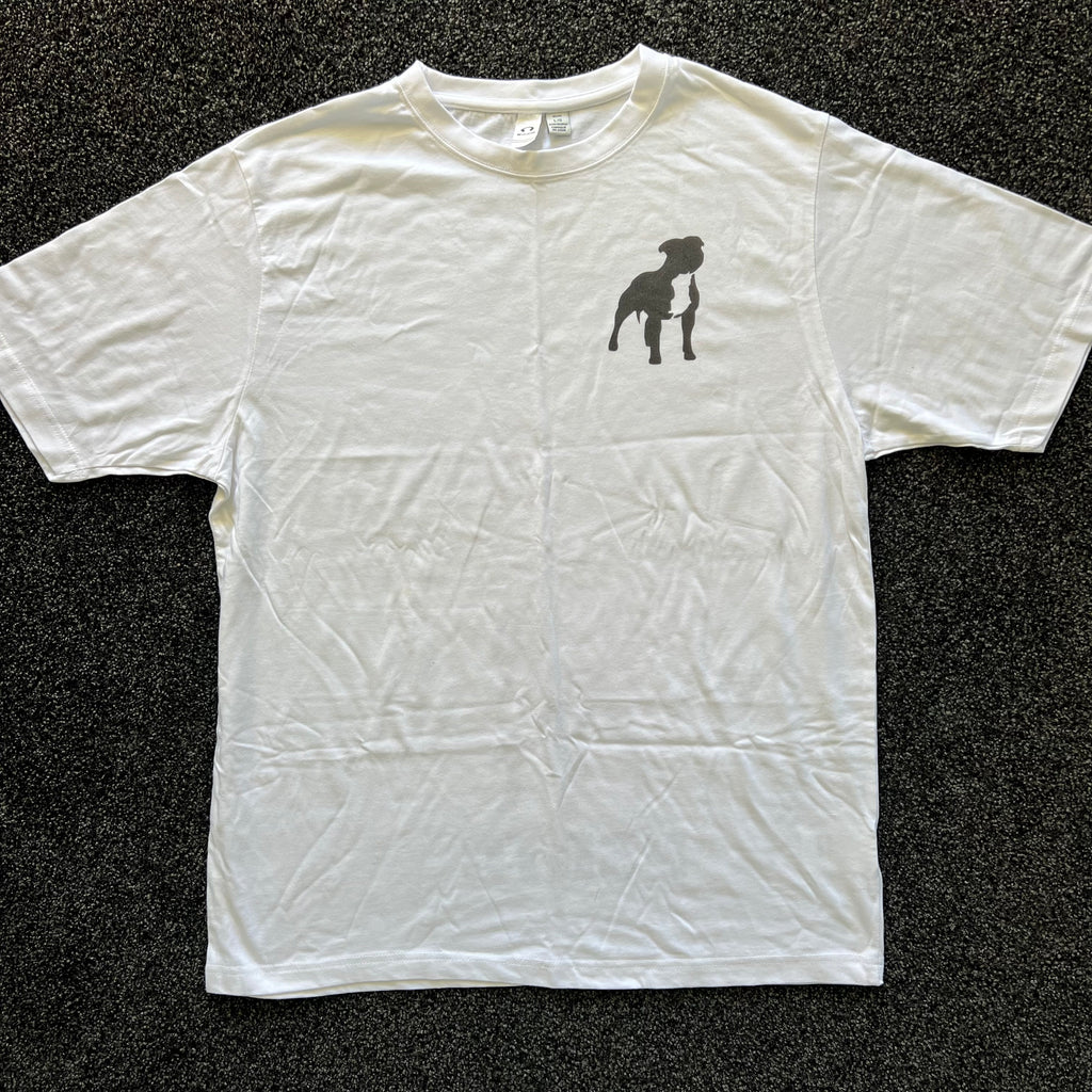 White t-shirt with a black silhouette design on a dark textured background