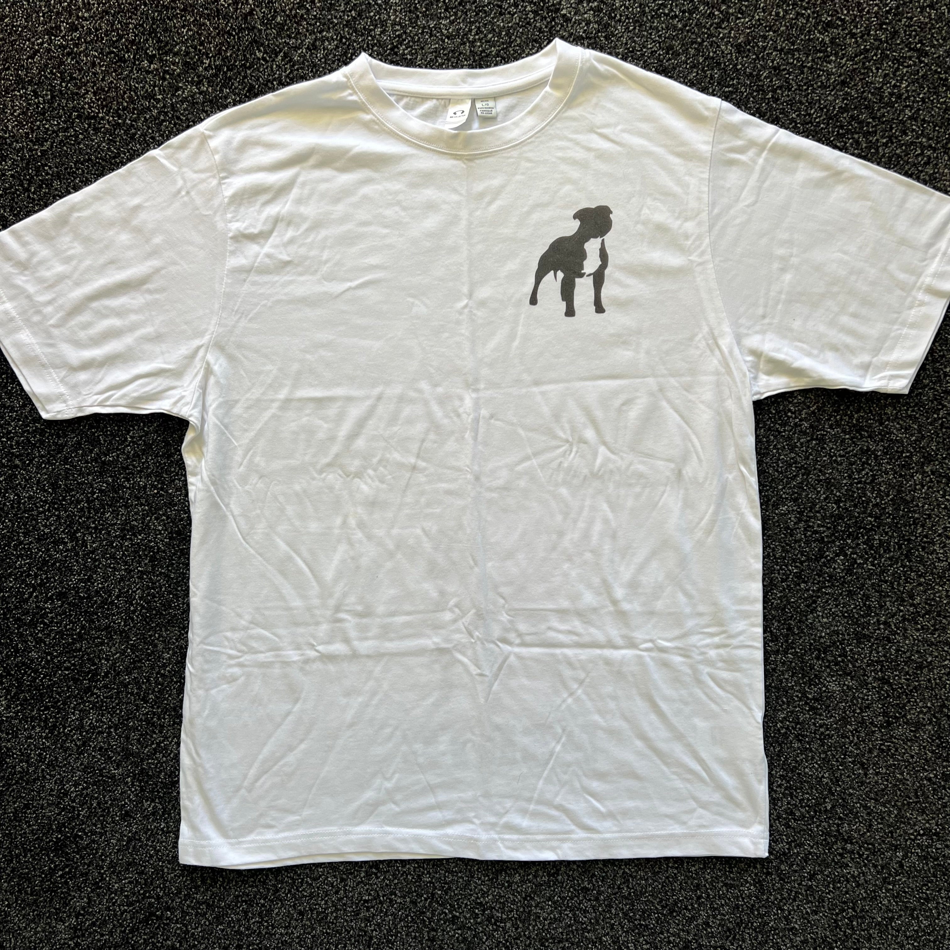 White t-shirt with a black silhouette design on a dark textured background