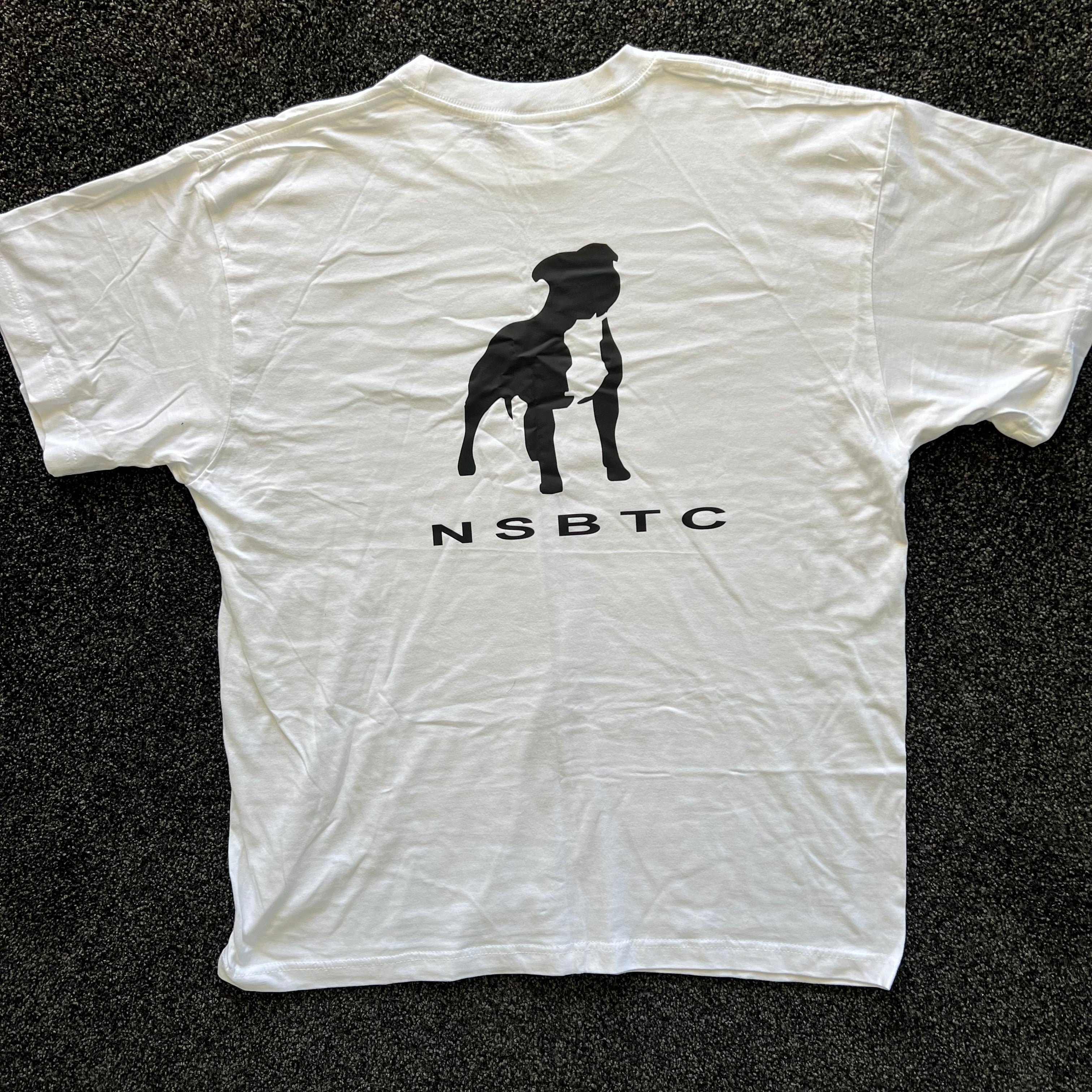 White t-shirt with black silhouette graphic and 'NSBTC' text on a dark background