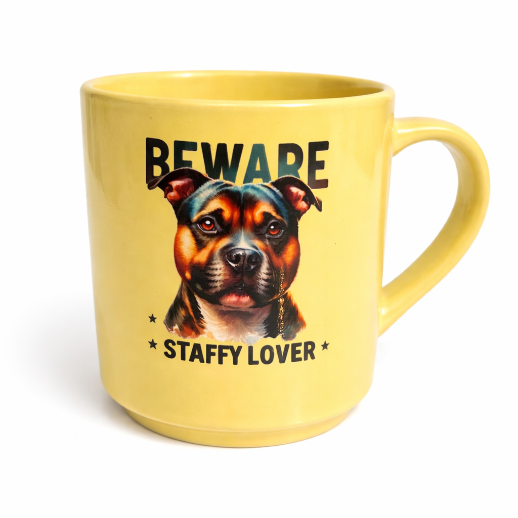Yellow mug with a Staffordshire Bull Terrier illustration and text on a white background